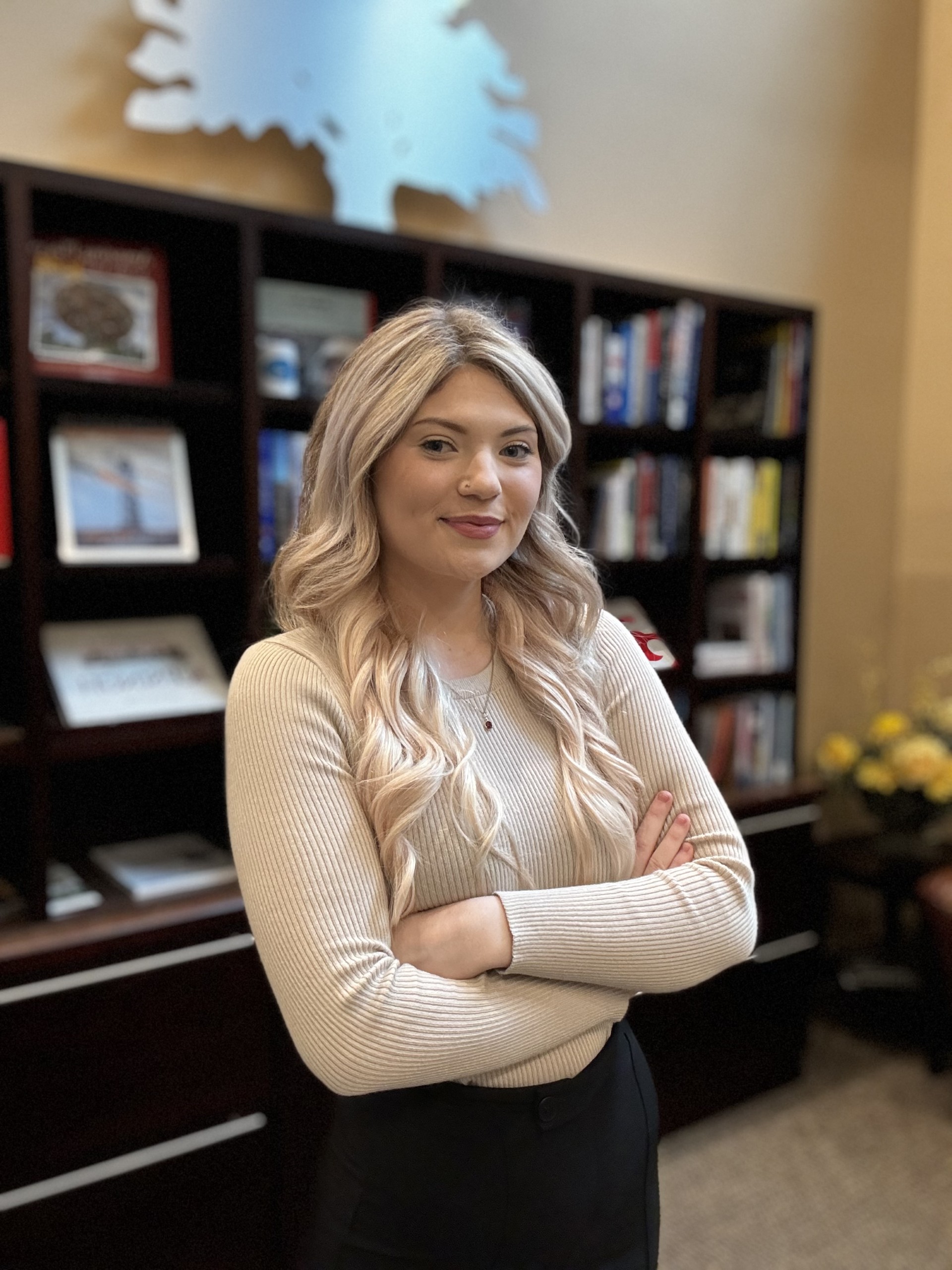 Katie Cunningham in front of FSG bookcase